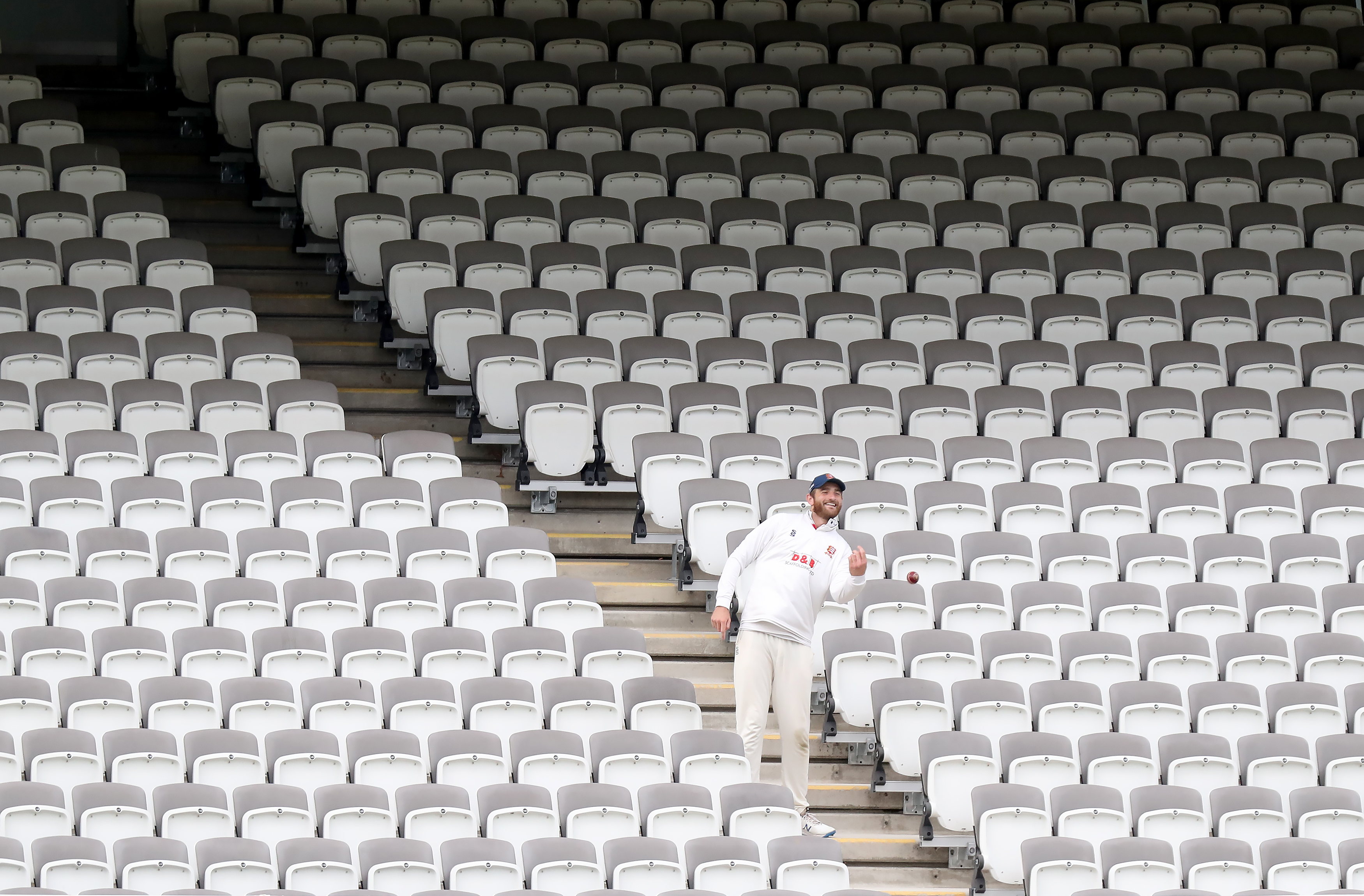 Paul Walter of Essex throws the ball back onto the field from the rows of empty seats during Somerset vs Essex in the Bob Willis Trophy Final at Lord's on 24 September.