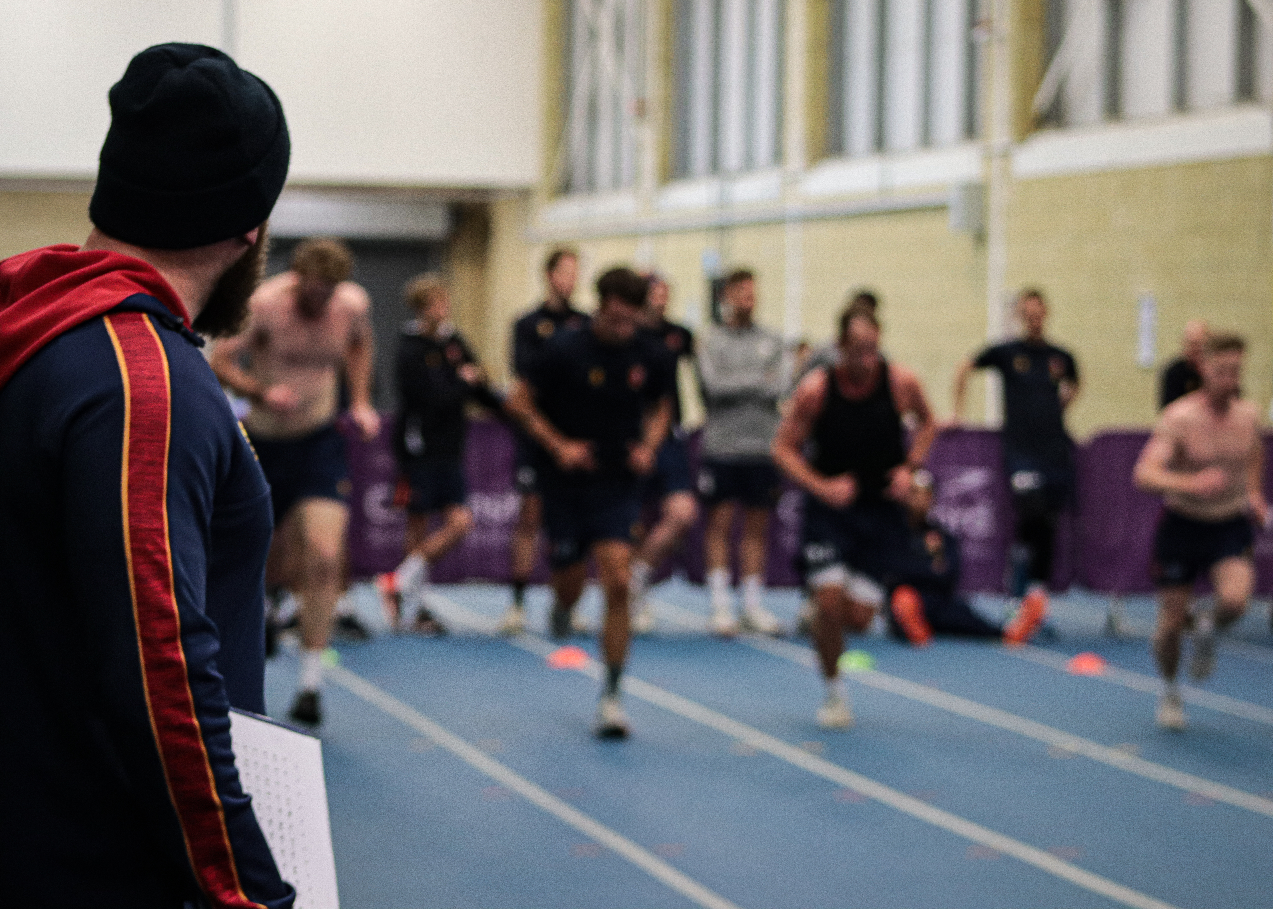 Essex Cricket Strength and Conditioning Coach, Harry McQueen watches on as the players take a fitness test.
